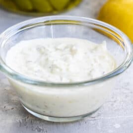 Tartar sauce in a small clear portion cup.