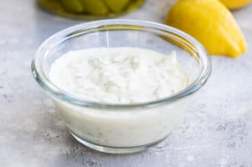 Tartar sauce in a small clear portion cup.