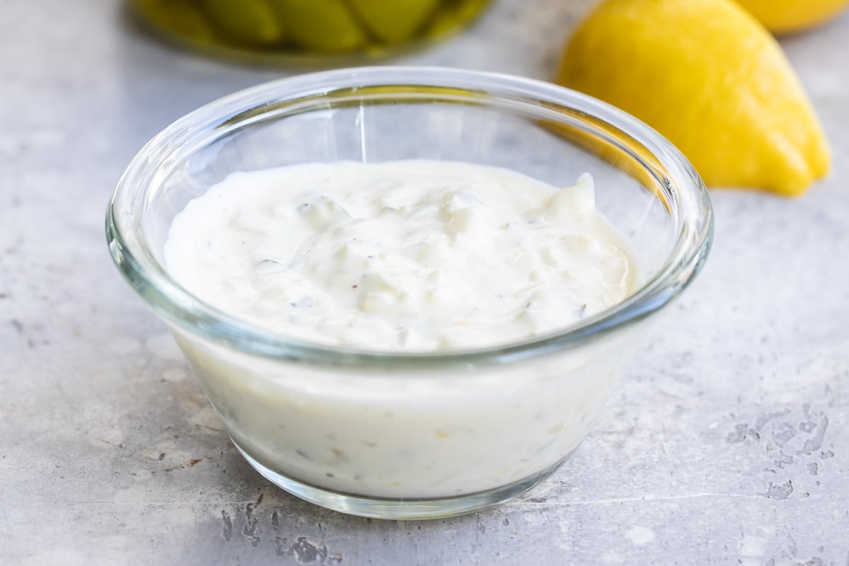 Tartar sauce in a small clear portion cup.