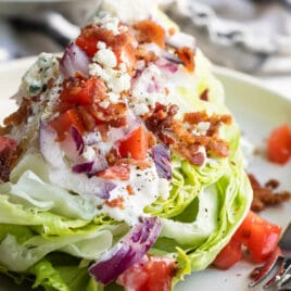 A wedge salad on a plate.