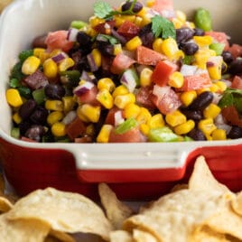 Black bean salsa in a red square dish.