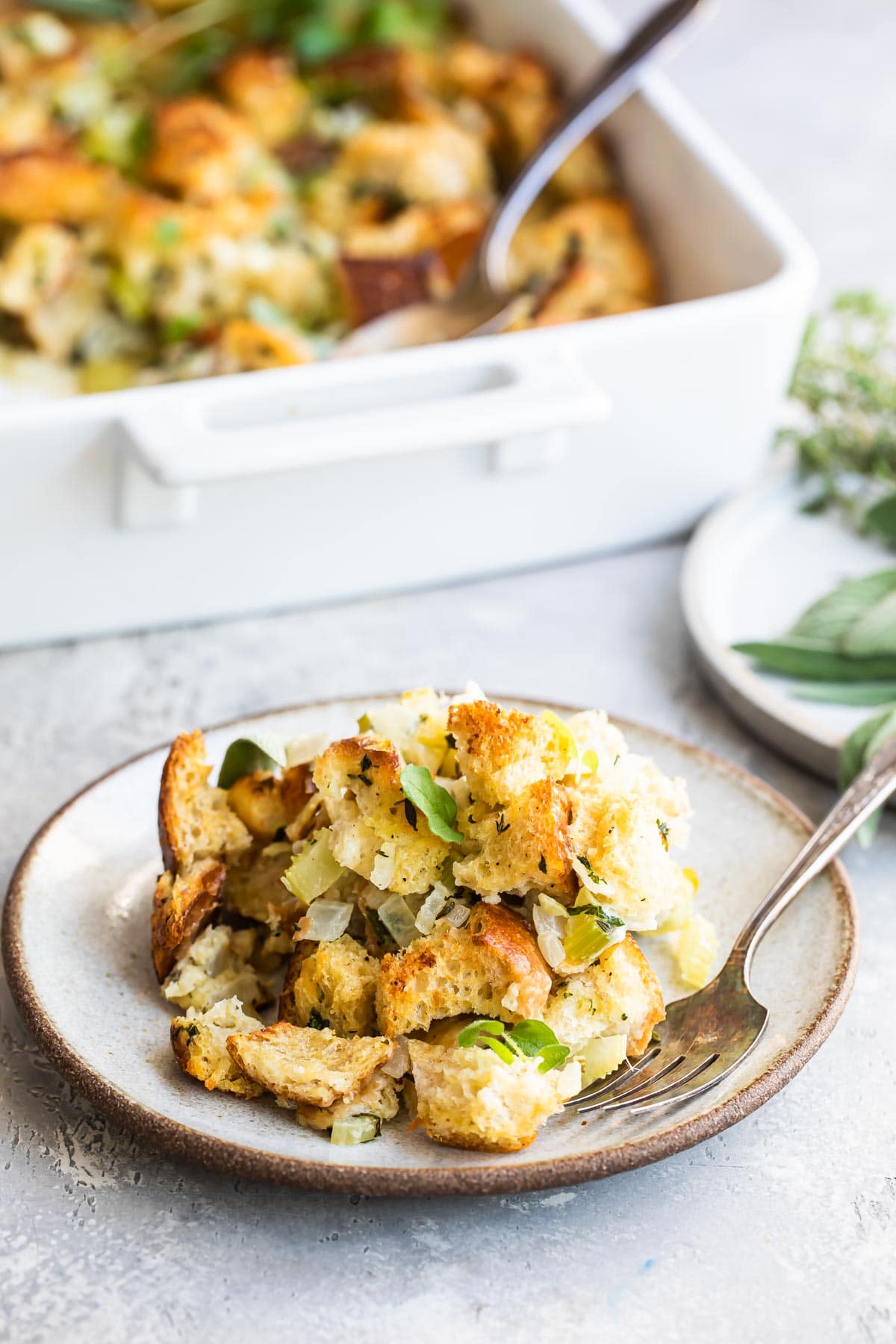 Bread stuffing on a plate with a fork.