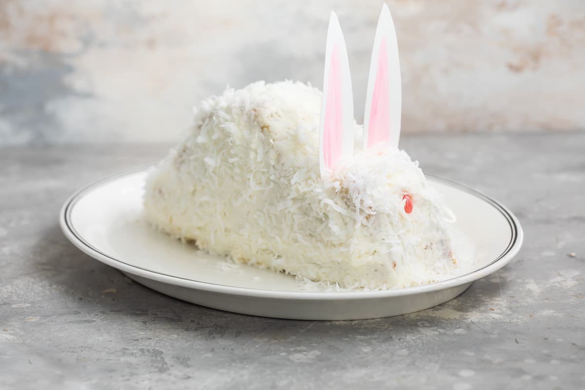 A bunny cake on an oval plate.