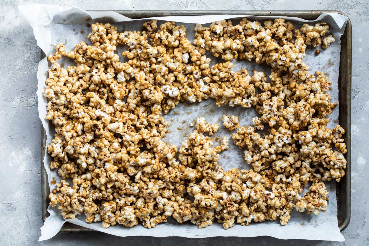 Caramel corn on a baking sheet.