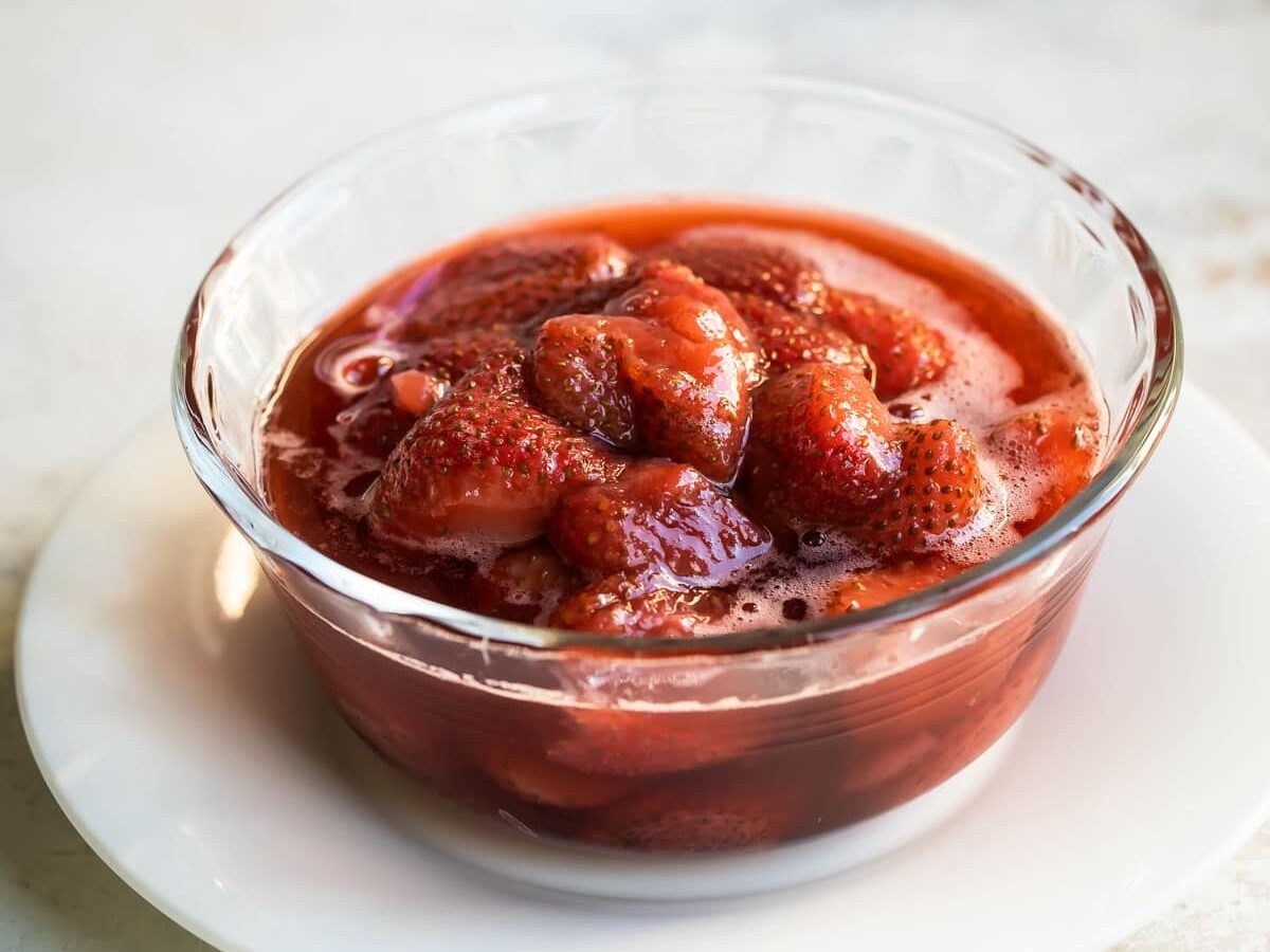 A bowl of strawberry topping.