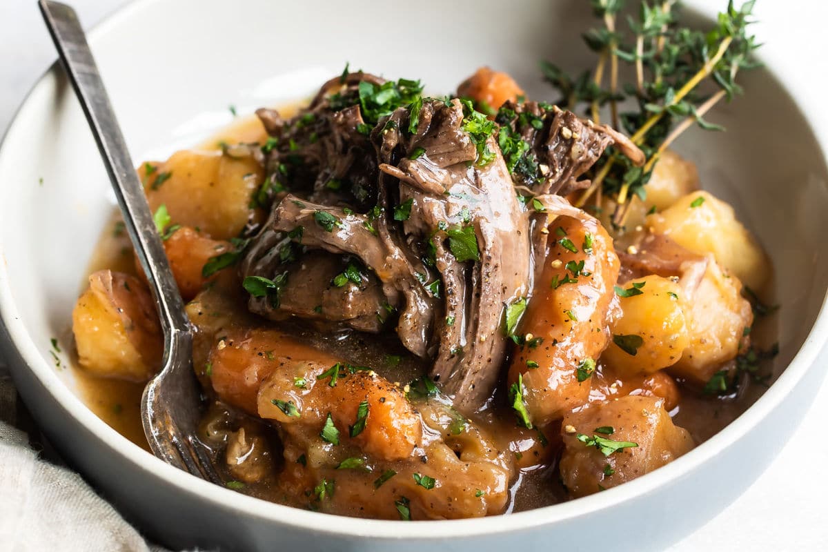 Pot roast and vegetables in a bowl.