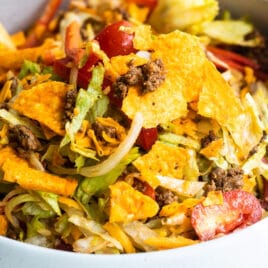 A white bowl filled with Dorito Taco Salad.