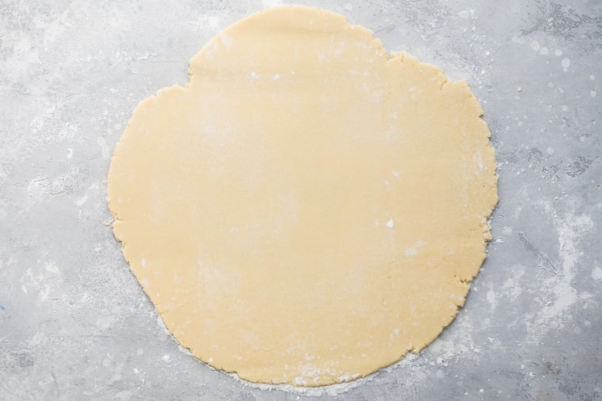 Dough for Easy Frosted Valentine cookies rolled out flat on a countertop.