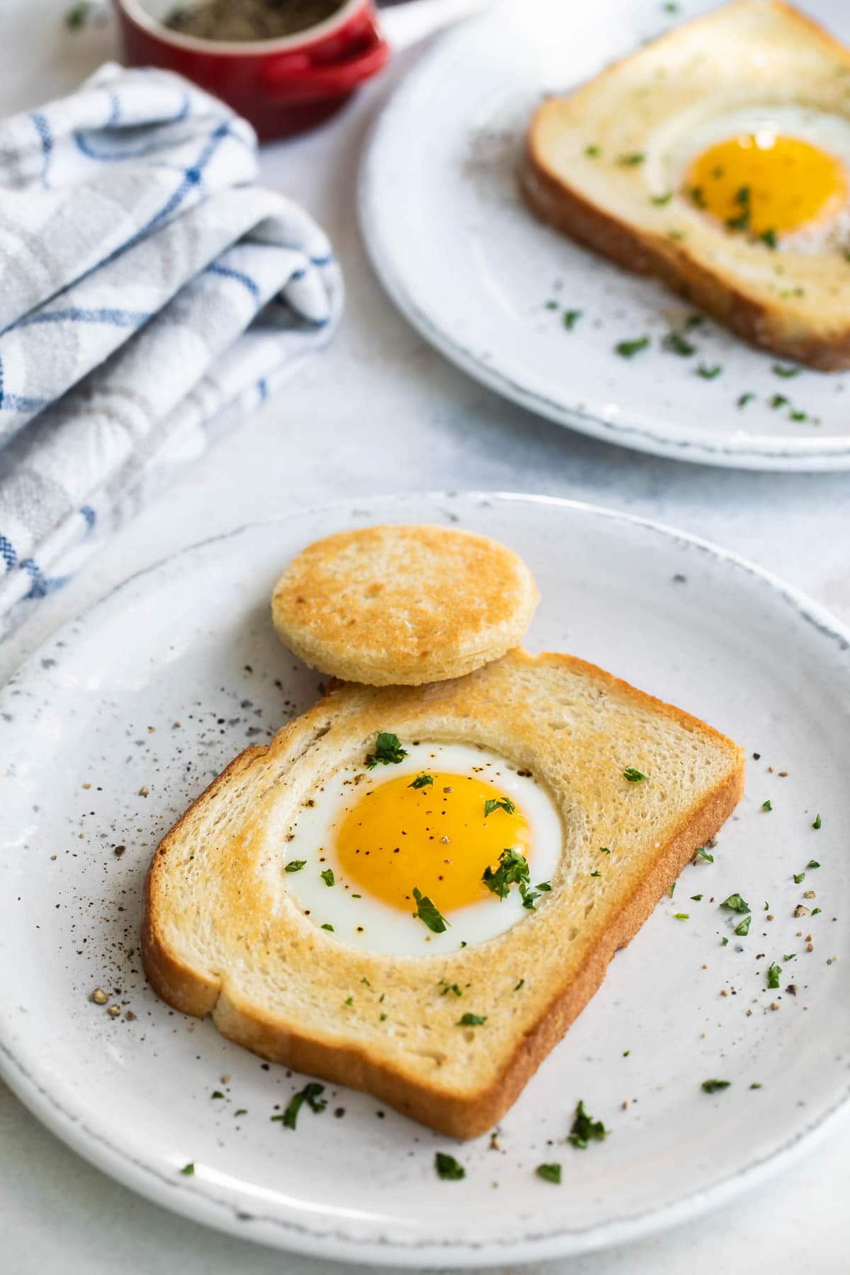 An egg cooked into a piece of bread.