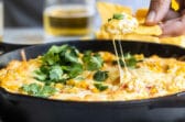 A skillet with hot corn dip.