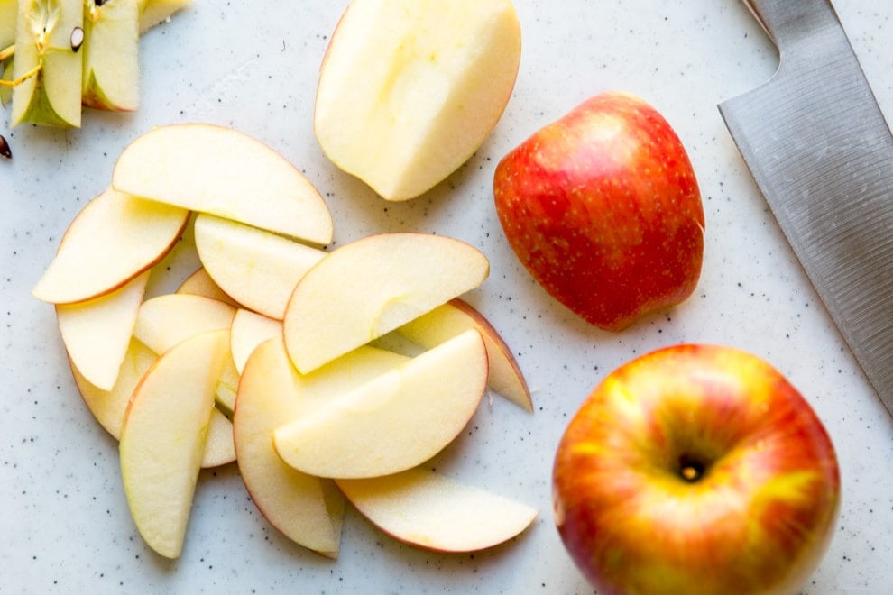 Apple slices on a cutting board.
