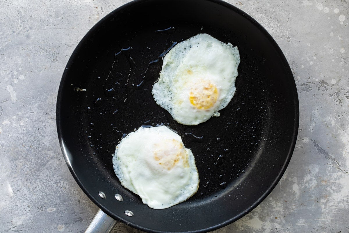 Eggs over medium in a skillet.