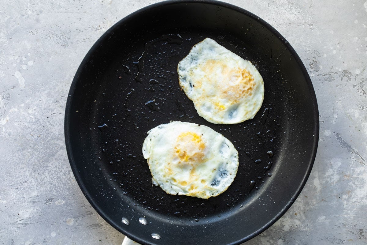 Eggs over hard in a skillet.