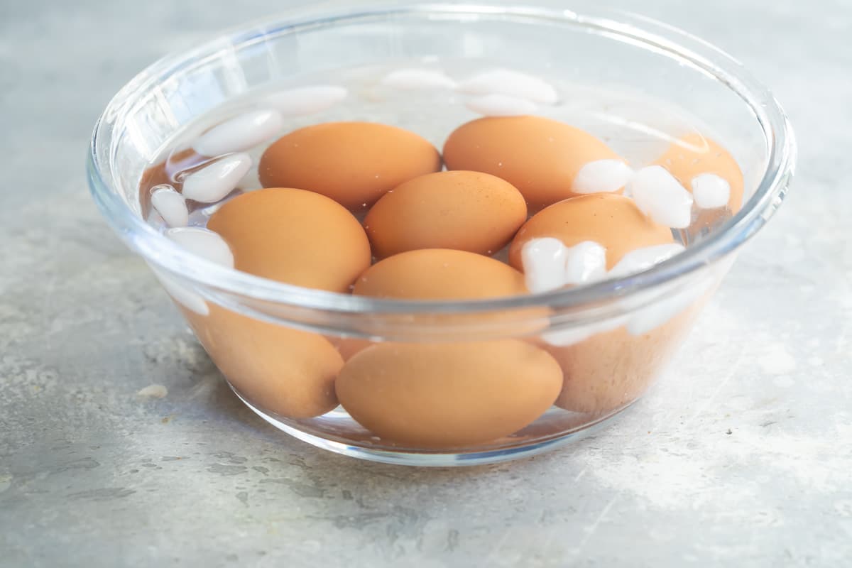 Hard-boiled eggs cooling in an ice bath.