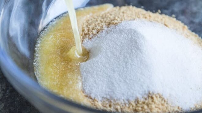Learn how to make a Graham Cracker Crust from scratch! The homemade version is sweet, buttery, and miles ahead of anything you can buy at the store.