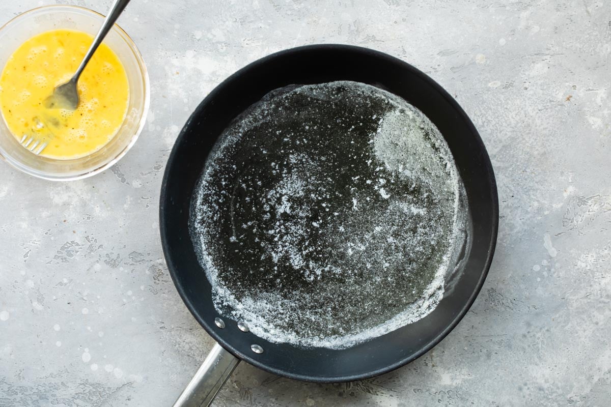Butter melted in a skillet.