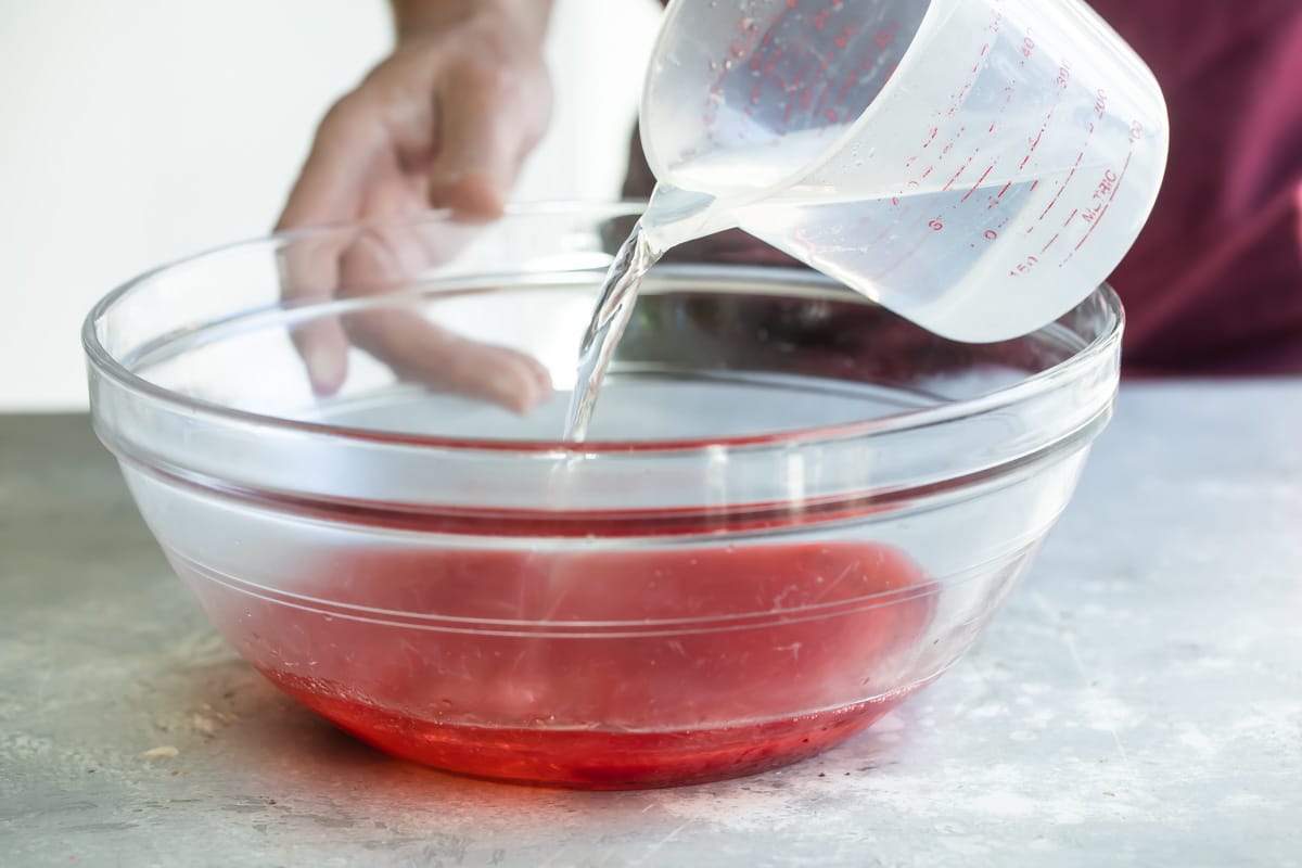 Mixing the ingredients for jello shots.