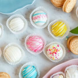 Lemon cookie balls decorated and arranged on a table.