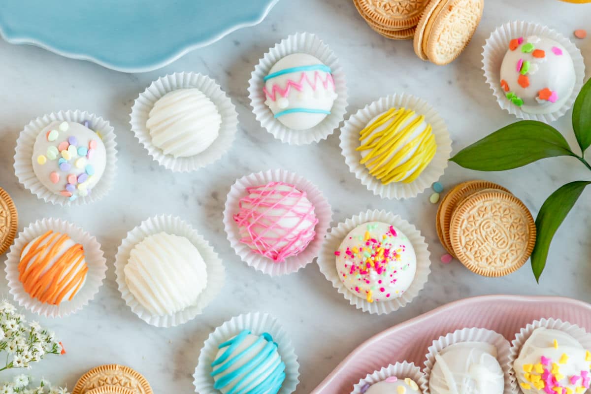 Lemon cookie balls decorated and arranged on a table.