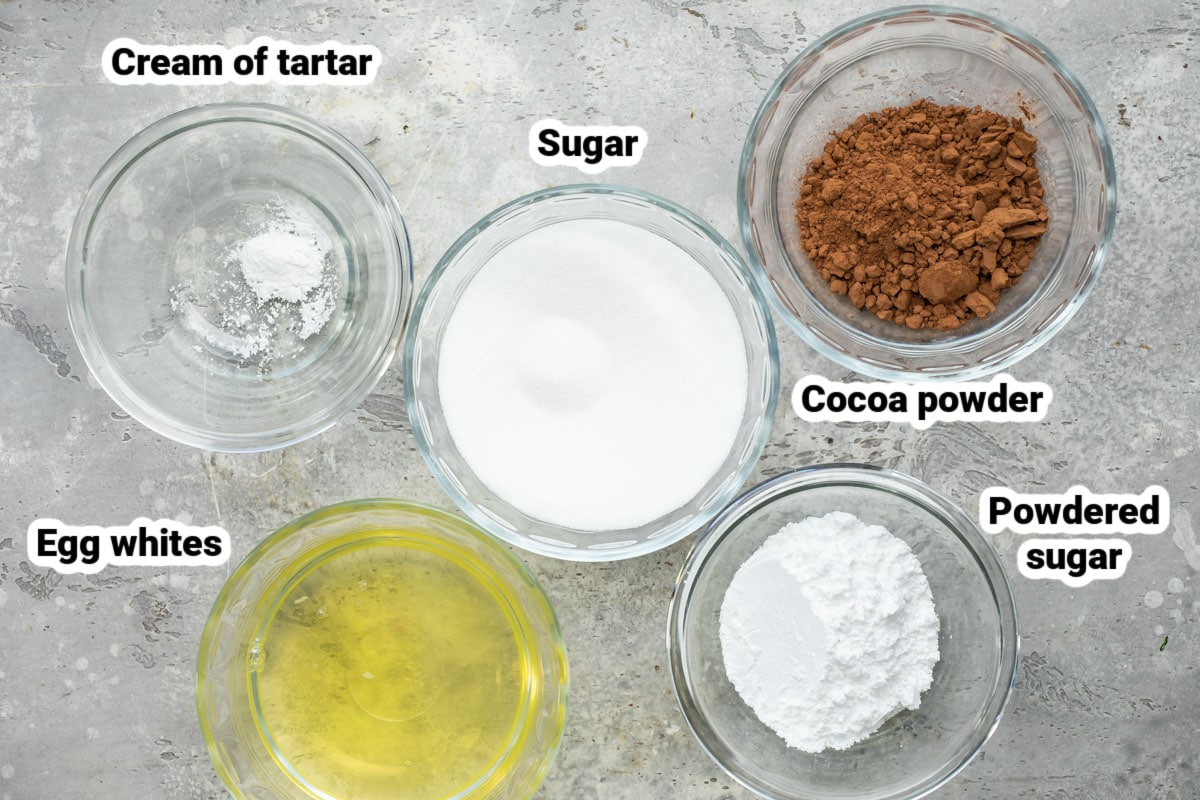 Labeled meringue mushroom ingredients in various bowls.