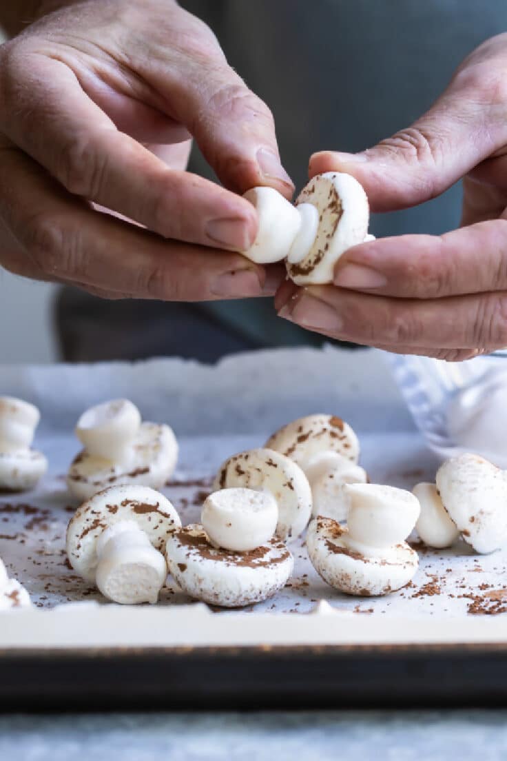 Assembling meringue mushrooms.