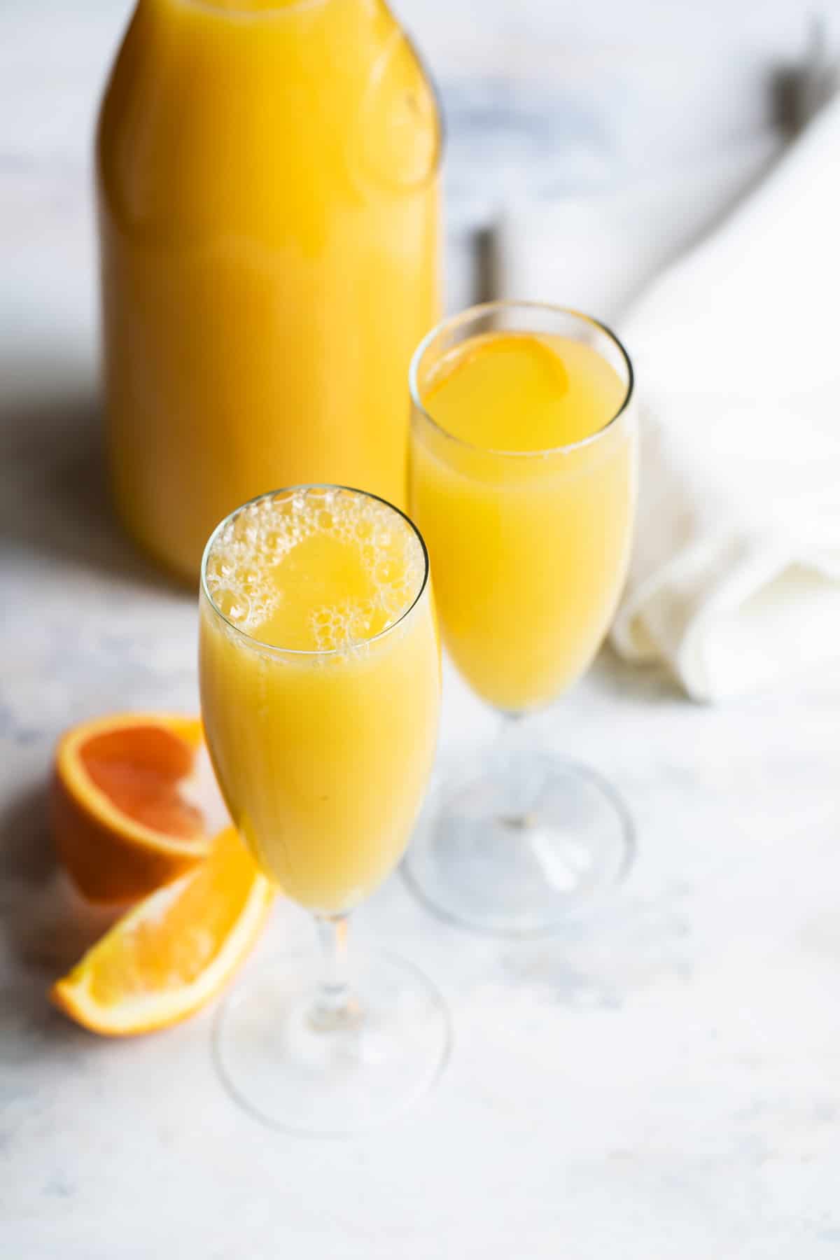 A mimosa cocktail in a champagne flute.
