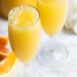 A mimosa cocktail in a champagne flute.
