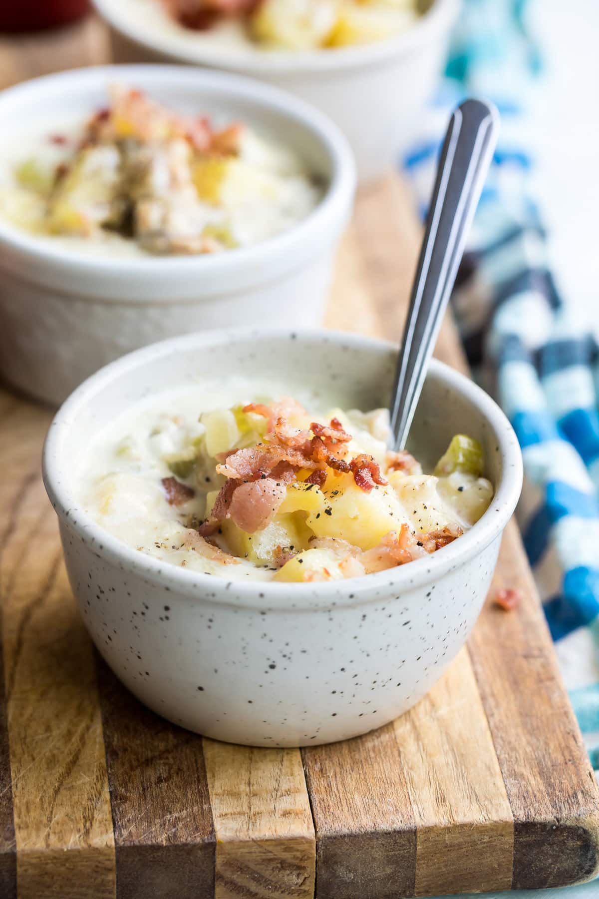 New England clam chowder in a white bowl.