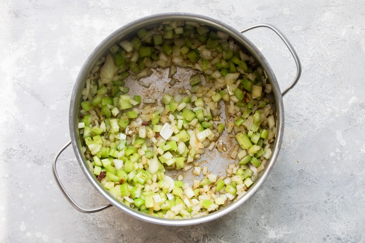 Chopped vegetables cooked in a silver pot.