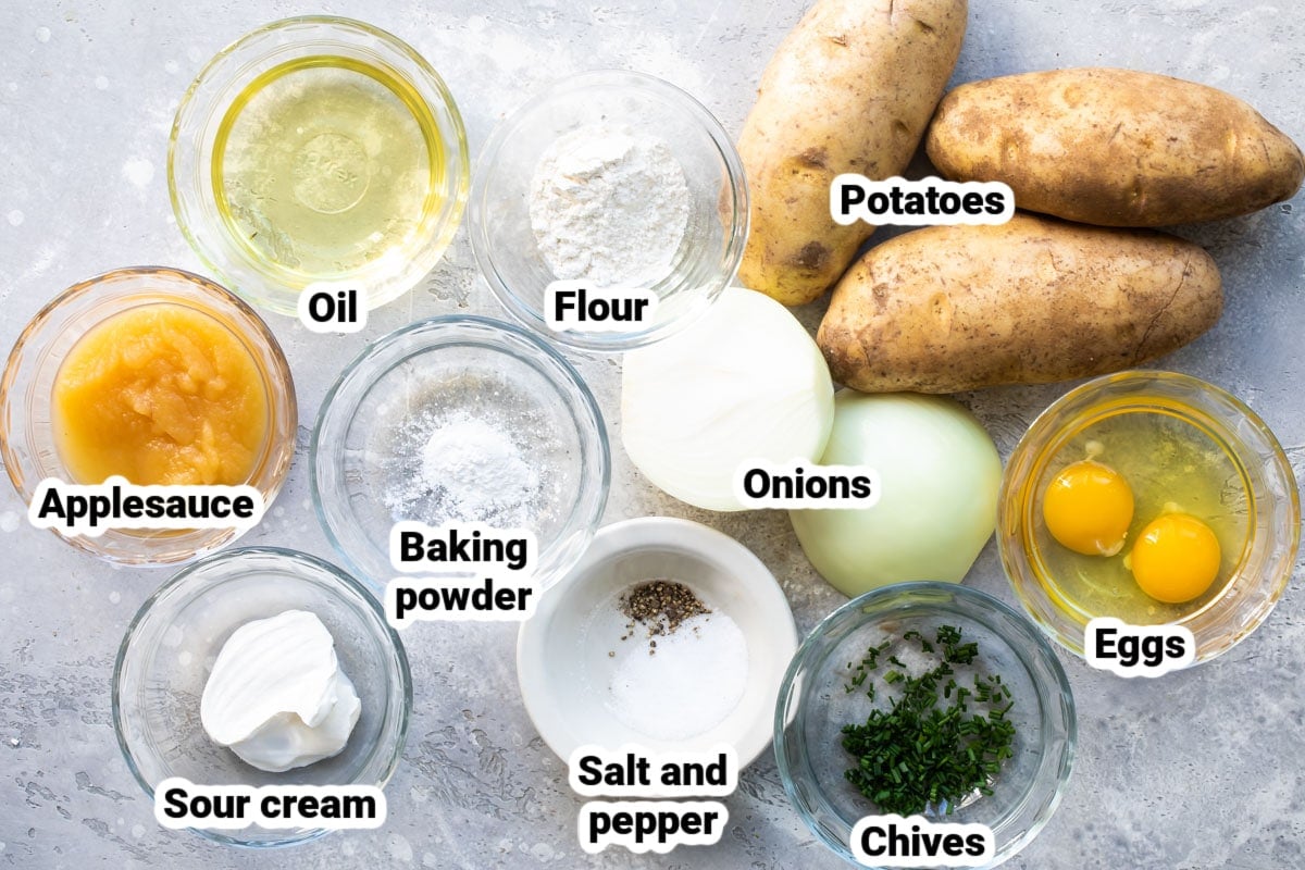 Labeled ingredients for potato latkes in various bowls.