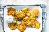Potato pancakes on a rectangular platter.