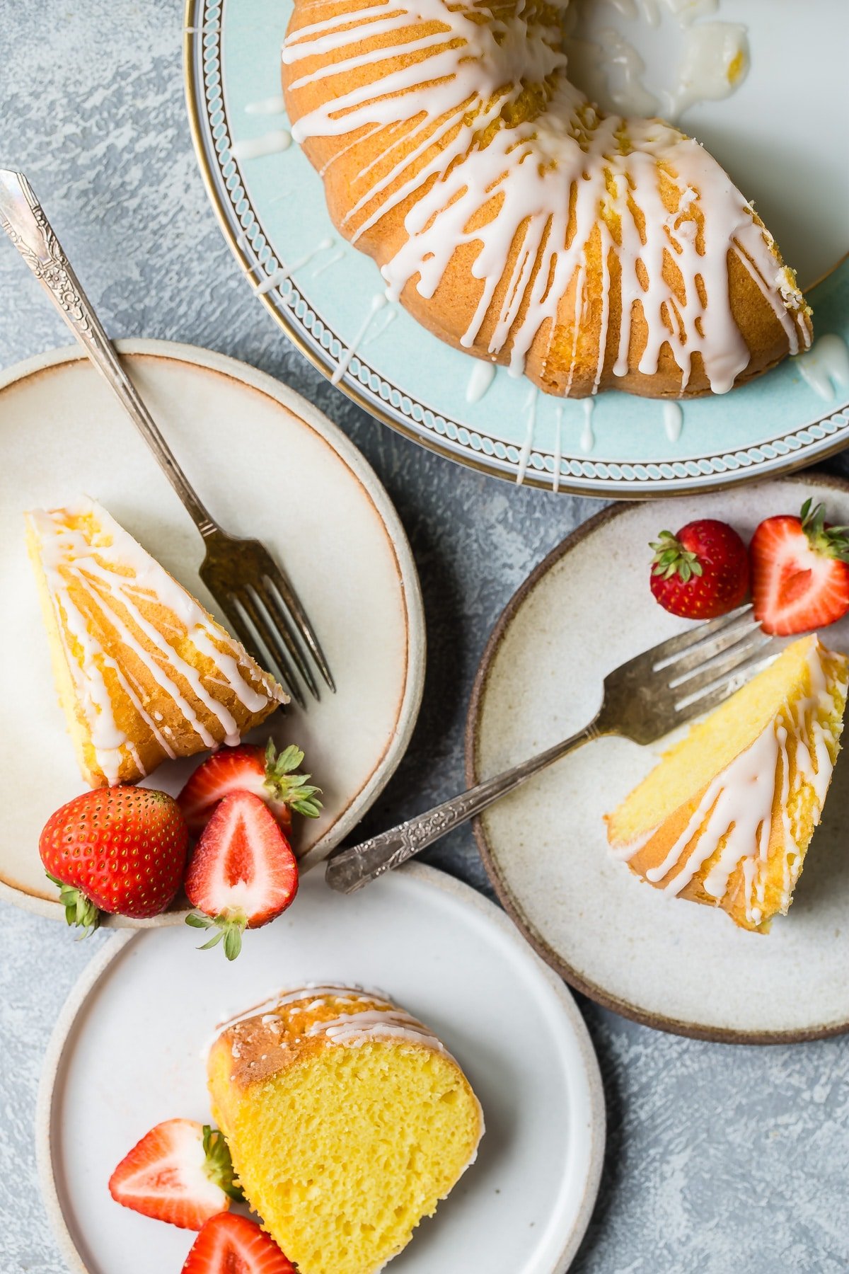 Lemon bundt cake slices on plates.