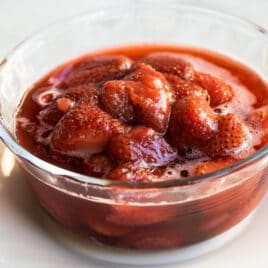 A bowl of strawberry topping.
