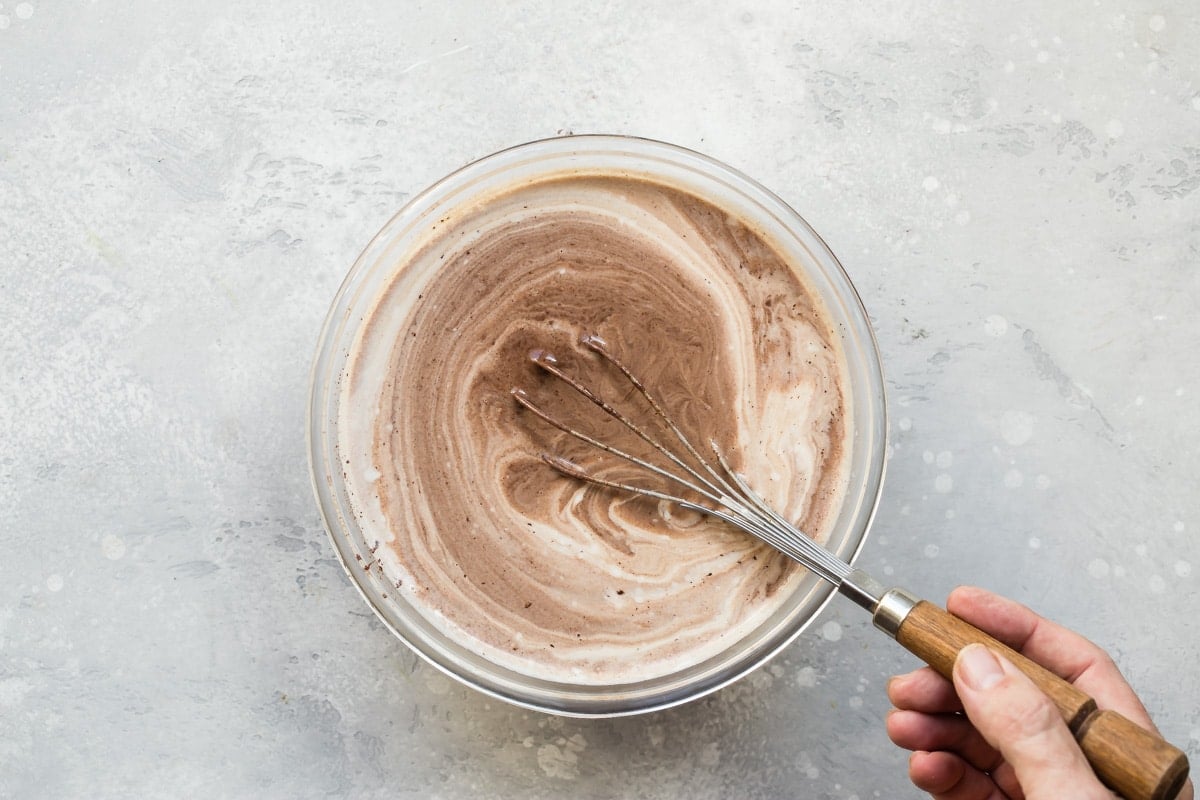Mixing chocolate into fondue.