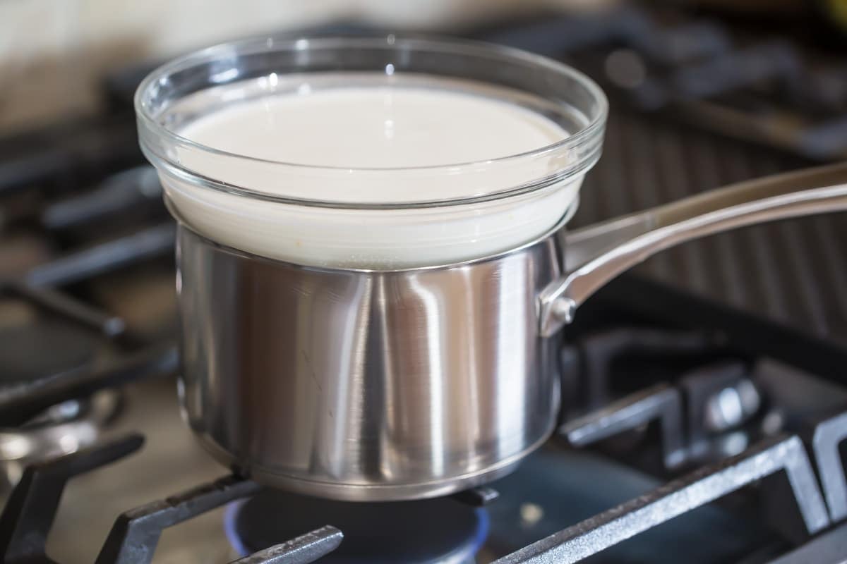 Making fondue on the stove.