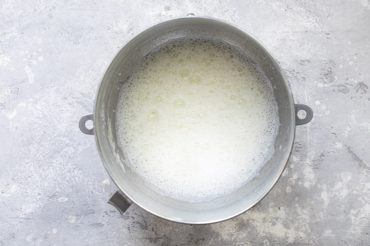 Egg whites whisked until soft in a mixing bowl.