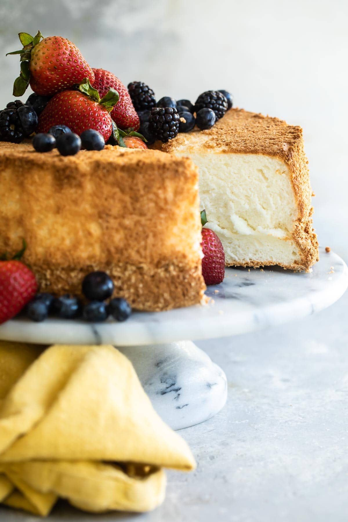 Angel food cake with fresh berries on top.