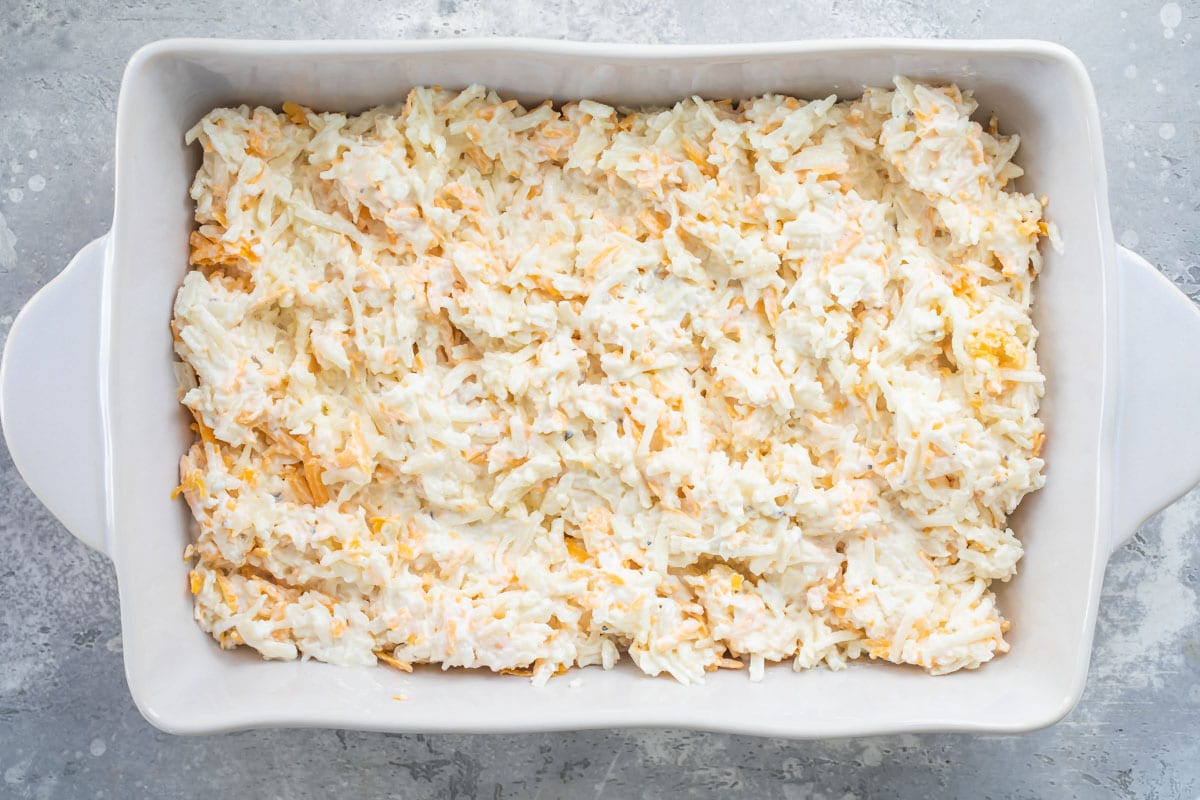 Cheesy potato casserole before baking.