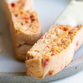 Cherry almond biscotti on a plate.