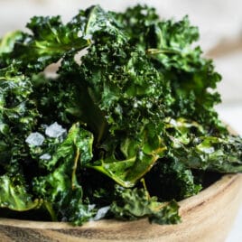 A bowl of baked kale chips.