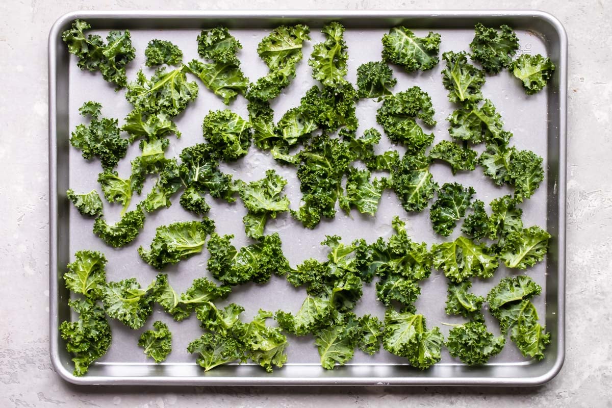 Kale chips on a baking sheet.
