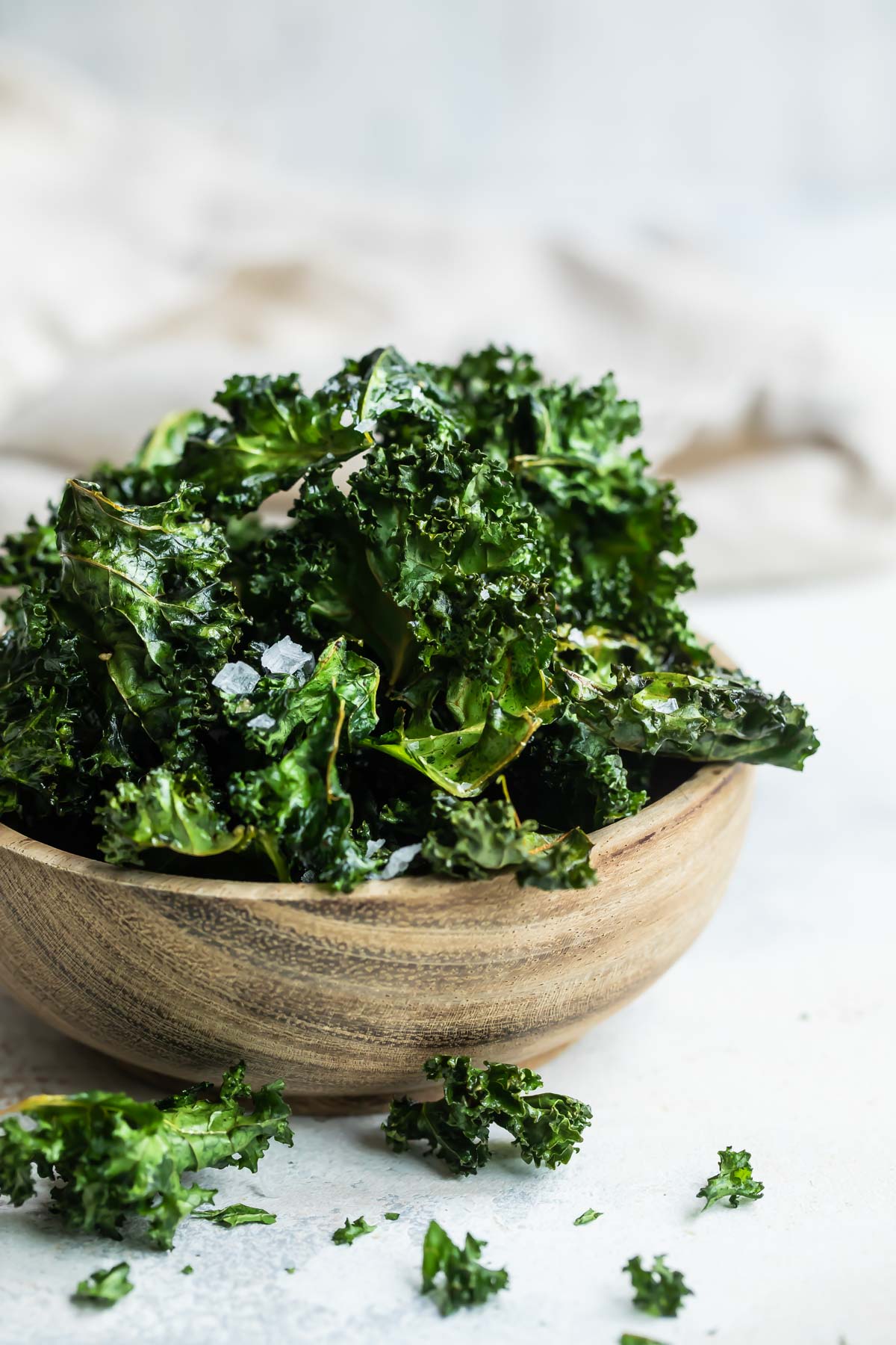 A bowl of baked kale chips.