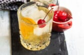 An amaretto sour cocktail in a clear glass.