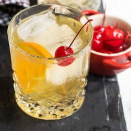 An amaretto sour cocktail in a clear glass.
