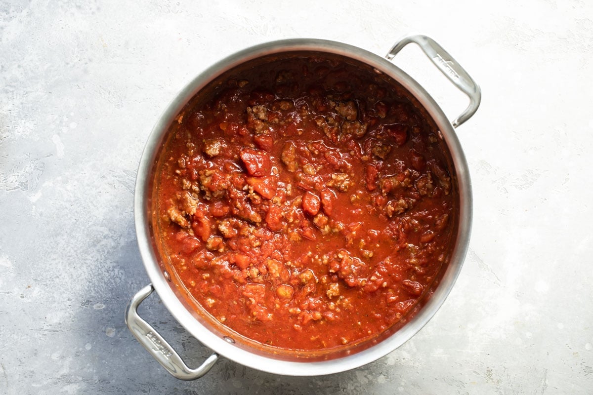 Meat sauce in a silver skillet.