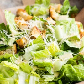 Caesar salad in a wooden bowl.
