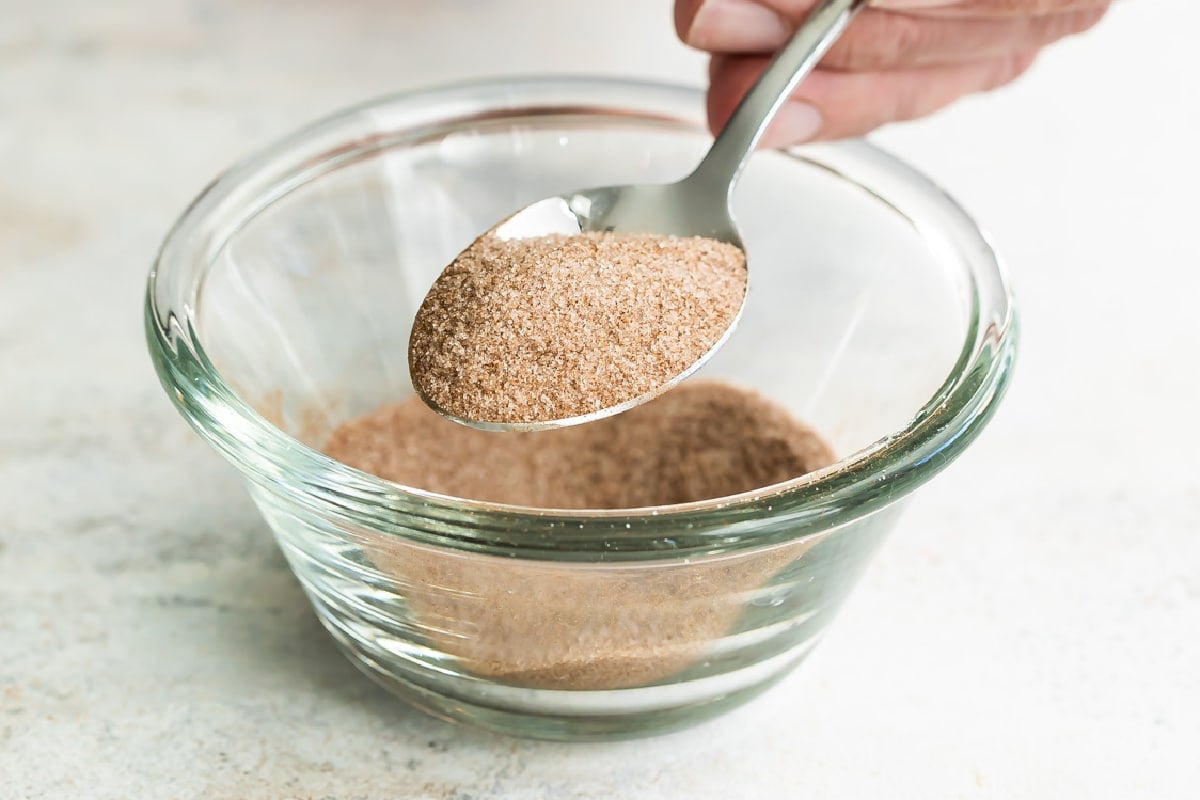 A bowl of cinnamon sugar topping.
