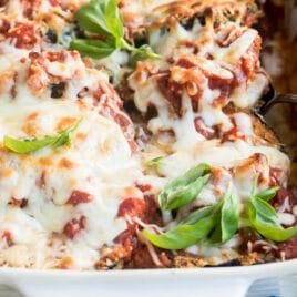 Eggplant parmesan in a white baking dish.