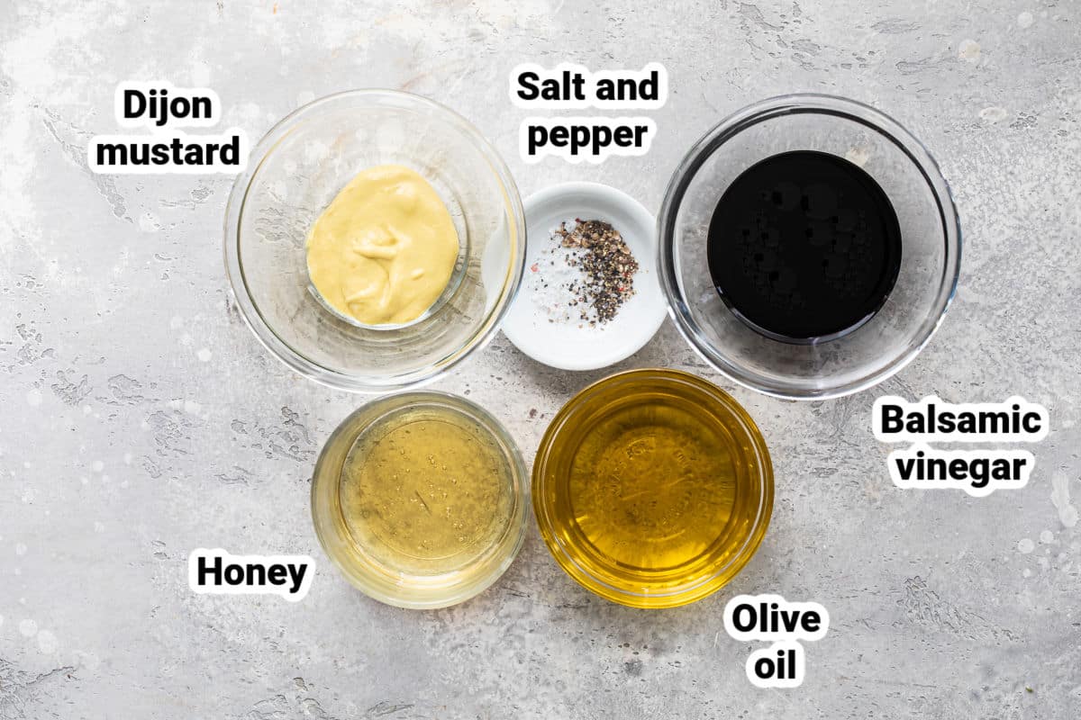 Ingredients for balsamic vinaigrette in bowls and labeled.