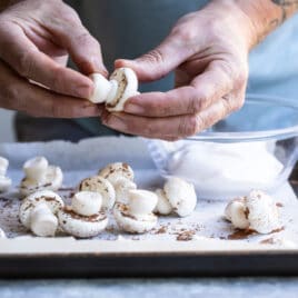 Assembling meringue mushrooms.